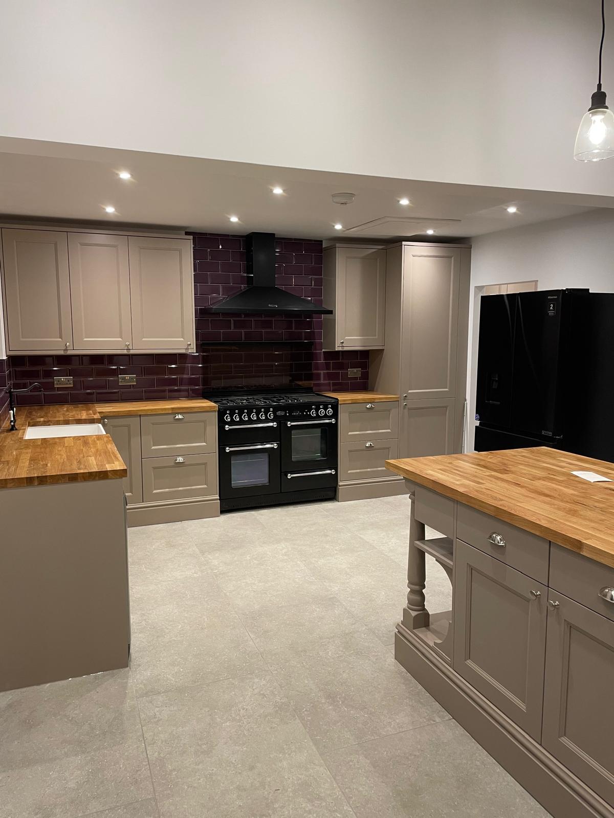 Fitted kitchen with modern worktops and flooring